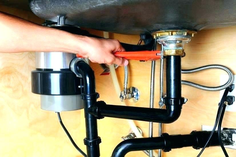 Plumber repairs disposer Greenville Plumbing Pros